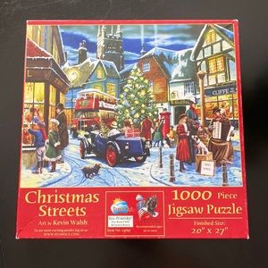 1000 piece puzzle. “Christmas Streets. Art by Kevin Walsh. Size: 20” x 27”.